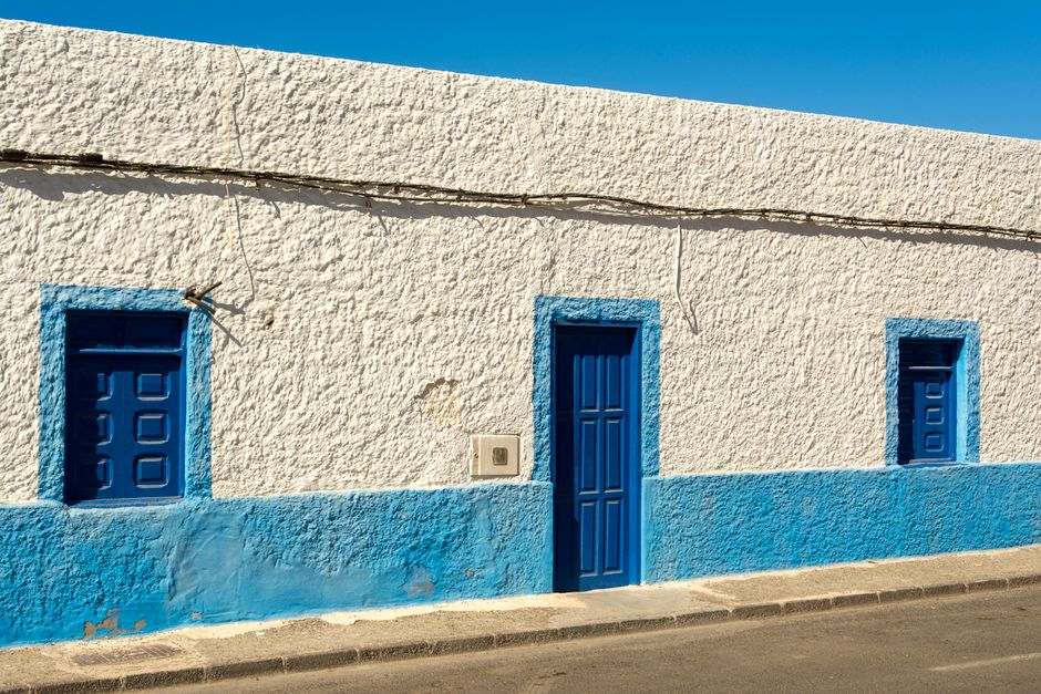 House exterior with a freshly painted wall